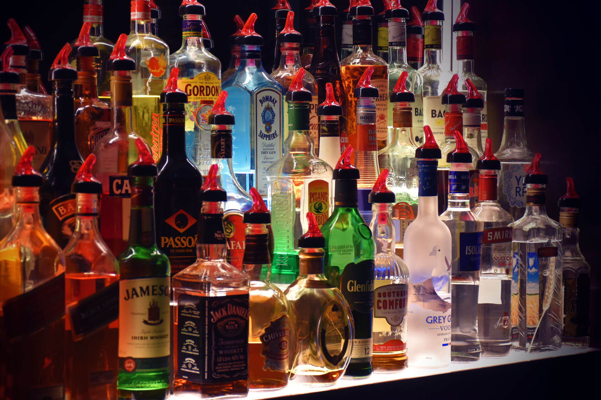 Illuminated bottles behind the bar