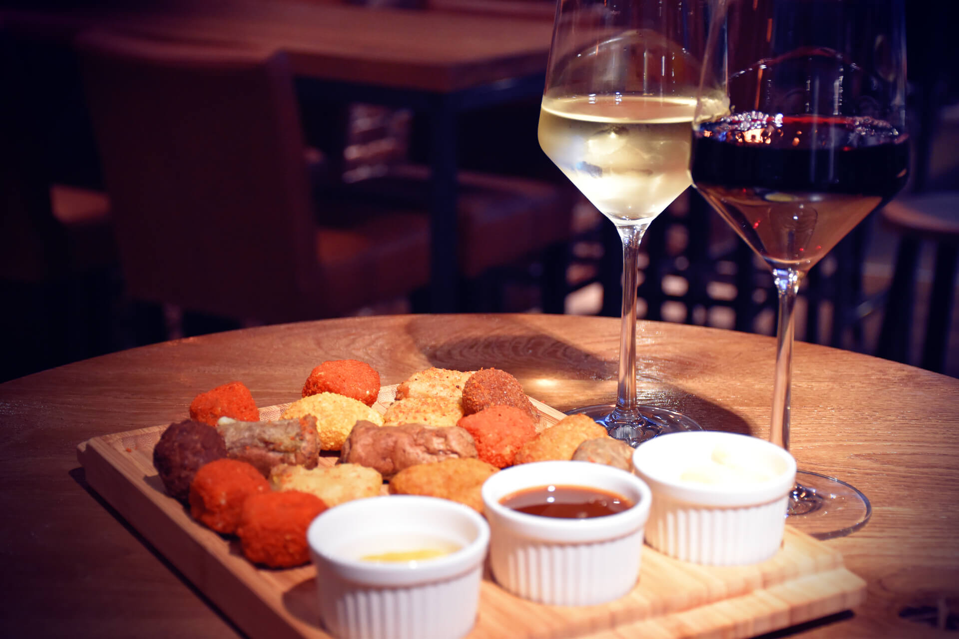 Bar snacks with a glass of wine